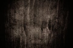 O muro de cimento cinzento escuro com imperfeições e o cimento natural texture como a textura assustador do fundo com vignetting fotos de stock O muro de cimento cinzento escuro com imperfeições e o cimento natural texture como a textura assustador do fundo com vignetting fotos de stock