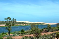 Oasis lagoon and white sand dunes. stock photo Oasis lagoon and white sand dunes. stock photo
