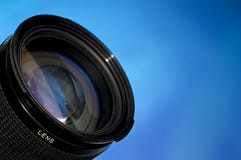 Obiettivo di fotographia sopra l'azzurro fotografia stock libera da diritti Obiettivo di fotographia sopra l'azzurro fotografia stock libera da diritti