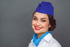 Occupazione professionale Condizione dell'hostess isolata sul primo piano felice sorridente di sguardo grigio della macchina foto immagine stock Occupazione professionale Condizione dell'hostess isolata sul primo piano felice sorridente di sguardo grigio della macchina foto immagine stock