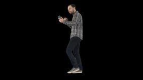 Ocio, tecnolog?a, comunicaci?n y concepto de la gente - hombre joven que usa e invitando a smartphone mientras que camina, alfa almacen de video Ocio, tecnolog?a, comunicaci?n y concepto de la gente - hombre joven que usa e invitando a smartphone mientras que camina, alfa almacen de video