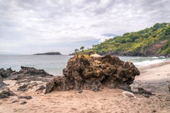 Offerings to the Balinese Hindu Gods and Demons placed on a coastal rock royalty free stock photo Offerings to the Balinese Hindu Gods and Demons placed on a coastal rock royalty free stock photo