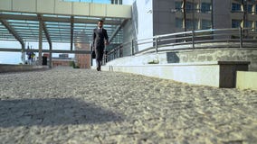Office employee in formalwear leaving business center at end of working day royalty free stock photography Office employee in formalwear leaving business center at end of working day royalty free stock photography