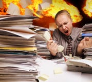 Office On Fire And Flying Paper Sheets Stock Images