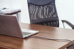 Workplace with notebook laptop .The office, in the office table and chair, on the table is a computer connected to the network royalty free stock photography Workplace with notebook laptop .The office, in the office table and chair, on the table is a computer connected to the network royalty free stock photography