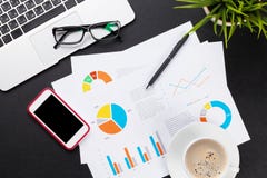 Office table with laptop, coffee, smartphone and reports royalty free stock image Office table with laptop, coffee, smartphone and reports royalty free stock image
