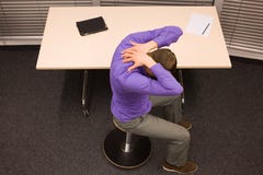 Office yoga - business man exercising at desk royalty free stock photo Office yoga - business man exercising at desk royalty free stock photo