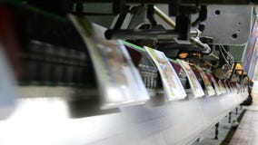 Offset magazine stitching process stock footage Offset magazine stitching process stock footage