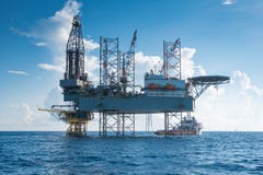 Offshore oil and gas drilling rig work over wellhead remote platform to compleation gases well. stock photo Offshore oil and gas drilling rig work over wellhead remote platform to compleation gases well. stock photo