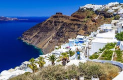 Oia town on Santorini island, Greece. Traditional and famous white houses and churches with blue domes over Caldera, Aegean sea royalty free stock photos Oia town on Santorini island, Greece. Traditional and famous white houses and churches with blue domes over Caldera, Aegean sea royalty free stock photos