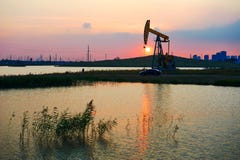 Oil Pumping Machine Sunset Lakeside Stock Photos