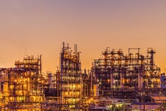 Oil refinery industrial plant or factory at sunset, storage distillery tanks and steel pipeline, modern petrochemical technologies royalty free stock photo Oil refinery industrial plant or factory at sunset, storage distillery tanks and steel pipeline, modern petrochemical technologies royalty free stock photo