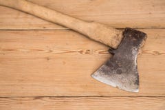 Old ax with a wooden handle stuck in wooden log. Concept for woodworking or deforestation. Selective focus. stock photography Old ax with a wooden handle stuck in wooden log. Concept for woodworking or deforestation. Selective focus. stock photography