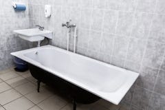 Old bathroom with sink and tiled walls. USSR stock photo Old bathroom with sink and tiled walls. USSR stock photo