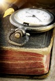 Old Book And Pocket Watch Stock Image