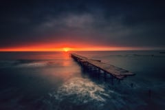 Old broken bridge in the sea, long exposure stock photos Old broken bridge in the sea, long exposure stock photos