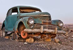 Old broken rusty abandoned car