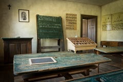 An old classroom with blackboard and boards with old script royalty free stock photo An old classroom with blackboard and boards with old script royalty free stock photo