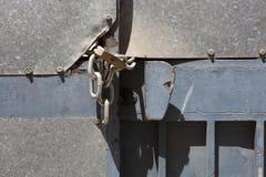 Old gate with a lock on the chain Royalty Free Stock Images Old gate with a lock on the chain Royalty Free Stock Images