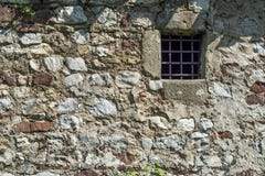Old Dark Age Stone Wall And Small Prison Cell Window With Bars Stock Images
