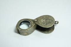 Old design unique , antique magnifying glass for looking amulet detail stock image Old design unique , antique magnifying glass for looking amulet detail stock image