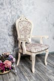Old fashioned interior with luxury armchair on ocher wallpaper background stock images Old fashioned interior with luxury armchair on ocher wallpaper background stock images