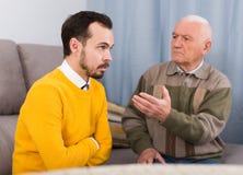 Old father and son serious talk stock image Old father and son serious talk stock image