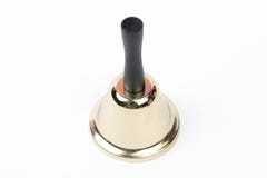 Old gold vintage school bell,hand bell made of brass with wooden handle stock image Old gold vintage school bell,hand bell made of brass with wooden handle stock image
