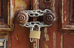 Old grungy wooden door with peeling paint and round door-handles stock photos Old grungy wooden door with peeling paint and round door-handles stock photos