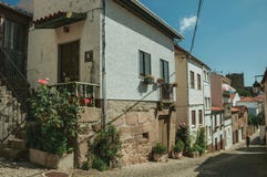 Old houses with flowering pots and deserted alley stock photos Old houses with flowering pots and deserted alley stock photos