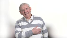 Old man with painful feelings in chest. Senior man with atherosclerotic cardiovascular disease. Identify different types of chest pains stock video footage Old man with painful feelings in chest. Senior man with atherosclerotic cardiovascular disease. Identify different types of chest pains stock video footage