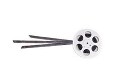 Old 8mm cine film and reel on white stock photos Old 8mm cine film and reel on white stock photos