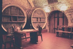 Old oak barrels in an ancient wine cellar. stock image Old oak barrels in an ancient wine cellar. stock image
