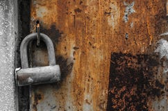 Old padlock on old rusty wall stock image Old padlock on old rusty wall stock image