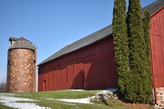 Old red barn in early winter with just a touch of snow on a sunny day on a farm royalty free stock photo Old red barn in early winter with just a touch of snow on a sunny day on a farm royalty free stock photo