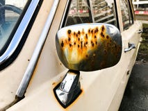 Old retro vintage hipster rusty oxidized metallic silver mirror of a retro antiquan car Maskar from the 60s, 70s, 80s, 90s, 2000s royalty free stock images Old retro vintage hipster rusty oxidized metallic silver mirror of a retro antiquan car Maskar from the 60s, 70s, 80s, 90s, 2000s royalty free stock images