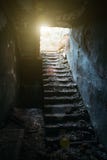 Old staircase and light from above in old, dark, creepy abandoned building, way to freedom concept stock photo Old staircase and light from above in old, dark, creepy abandoned building, way to freedom concept stock photo