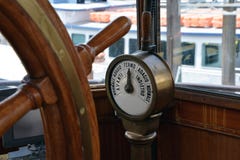 Old steamboat bridge, steering wheel and commanding gear. Steering wheel and commanding engine gear detail in an old steamboat cockpit stock photos Old steamboat bridge, steering wheel and commanding gear. Steering wheel and commanding engine gear detail in an old steamboat cockpit stock photos