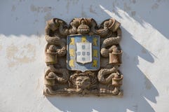 Old stone carved portuguese coat of arms