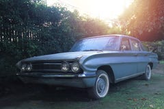 Old style antique car Parked in a garden with fences around stock photography Old style antique car Parked in a garden with fences around stock photography