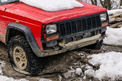 Old SUV with a flat tire. Journey through the Carpathian mountains in Eastern Europe Royalty Free Stock Photo Old SUV with a flat tire. Journey through the Carpathian mountains in Eastern Europe Royalty Free Stock Photo