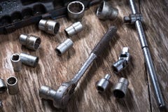 Old tools on wooden background .Socket Wrench royalty free stock images Old tools on wooden background .Socket Wrench royalty free stock images