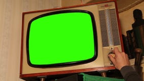 Old TV with green screen, retro TV in an old interior with a green screen