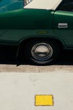 An old vintage green car`s tire stock photo An old vintage green car`s tire stock photo