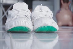 Old white shoes used to play sports. stock photo Old white shoes used to play sports. stock photo
