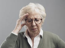 Old woman having a bad headache royalty free stock images Old woman having a bad headache royalty free stock images