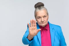 Old woman showing stop sign at camera royalty free stock photos Old woman showing stop sign at camera royalty free stock photos