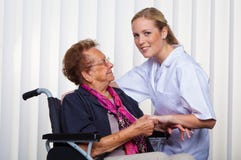 Old woman in a wheelchair and a nurse stock photography Old woman in a wheelchair and a nurse stock photography