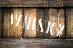 Old wooden box containing bottles of whiskey. royalty free stock image Old wooden box containing bottles of whiskey. royalty free stock image