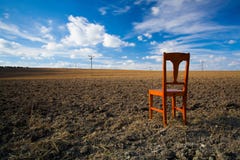 Old Wooden Chair On The Empty Field Royalty Free Stock Photos